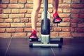 Active woman using exercise bike at the gym. Royalty Free Stock Photo