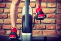 Active woman using exercise bike at the gym. Royalty Free Stock Photo