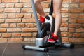 Active woman using exercise bike at the gym. Royalty Free Stock Photo