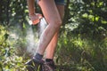 Active woman using insect repellent Royalty Free Stock Photo