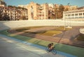 Active women cycling inside velodrome for sportsmen with cycles