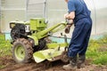 Active Worker Elderly Man With Tractor On Agricultural Field In Spring Close Royalty Free Stock Photo