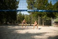 Active young couple play beach volley on hot wimmer day