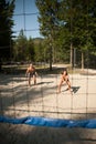 Active young couple play beach volley on hot wimmer day