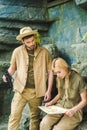 active young couple in safari suits trying to navigate