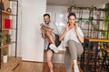 Couple doing low kicks while working out together at home Royalty Free Stock Photo