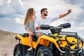 active young couple taking selfie while sitting on ATV Royalty Free Stock Photo