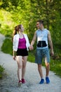 Active young couple on a wlak in the park