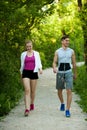 Active young couple on a wlak in the park