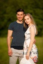 Active young couple on a wlak in the park on hot summer afternoon