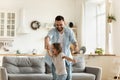 Active young father dancing to music with daughter. Royalty Free Stock Photo
