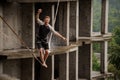 Active young man balancing on a slackline