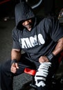 Active young man bodybuider working out in the gym. Handsome strong man training hard in the gym.