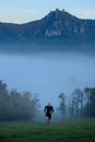 Active young man, runner train in misty autumn nature. Grey color tone Royalty Free Stock Photo