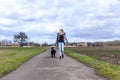 Active young woman jogging with her pet dog Royalty Free Stock Photo