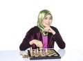 Active young woman playing chess over white background