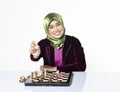 Active young woman playing chess over white background