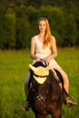 Active young woman ride a horse in nature Royalty Free Stock Photo