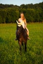 Active young woman ride a horse in nature Royalty Free Stock Photo