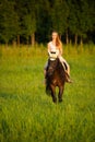 Active young woman ride a horse in nature Royalty Free Stock Photo