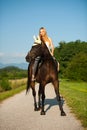 Active young woman ride a horse in nature Royalty Free Stock Photo