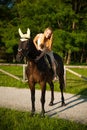 Active young woman ride a horse in nature Royalty Free Stock Photo