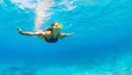 Active young woman in snorkeling mask dive, swim underwater Royalty Free Stock Photo