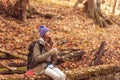 Woman eating a sandwich while taking a hiking break Royalty Free Stock Photo