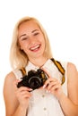Active young woman taking photos with retro camera isolated over Royalty Free Stock Photo