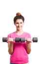 Active young woman working out with two dumbbells Royalty Free Stock Photo