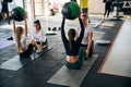 Active young women enjoying exercising in pairs Royalty Free Stock Photo