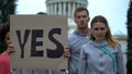 Activist chanting in support of presidential candidate, showing Yes, vote choice Royalty Free Stock Photo