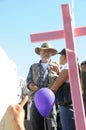 Activist Javier Sicilia behind pink cross