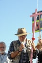 Activist Javier Sicilia holding pink cross