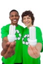 Activists holding energy saving light bulbs Royalty Free Stock Photo