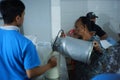 Activities of residents and employees are sorting cow`s milk
