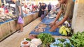 Activities of selling fish and vegetables at a traditional market in the morning in