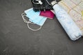 Wallet passport water bottle on world map and face mask. Stop spreading coronavirus Royalty Free Stock Photo