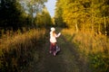 A little girl with a map on a forest trail Royalty Free Stock Photo