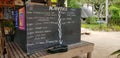 Daily activity board at tropical resort Fiji with guitar and bar drinks menu