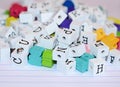 Craft beads and alphabet block jumble on paper