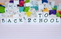 Craft beads and alphabet blocks spell Back to School