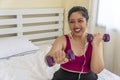 Activity exercise fit body for diet or obesity concept. Positive overweight fat woman with measure tape on neck holding dumbbell Royalty Free Stock Photo