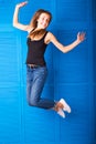Activity and happiness concept - smiling teenage girl in white blank t-shirt jumping Royalty Free Stock Photo