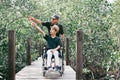 Activity outdoor with family on wheelchair travel holiday Royalty Free Stock Photo