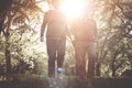 Senior couple jogging and exercising together in park. Royalty Free Stock Photo