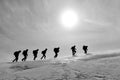 Group of mountaineers moving in harmony towards the summit of the mountains Royalty Free Stock Photo