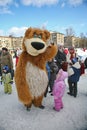 Actor animator of the house of culture of the city metallostroy in the costume of the jolly bear entertains children and adults