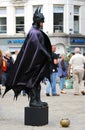 Actor in Batman costume in the central Dam square in Amsterdam.