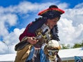 Actor man in historical pirate costume making a show outdoors